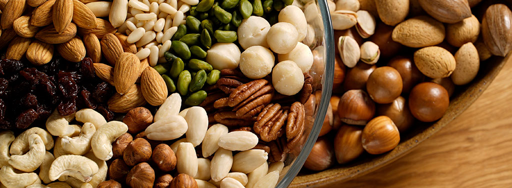 Variety of nut kernels, nut in-shell, pine nut kernels and sultana raisins